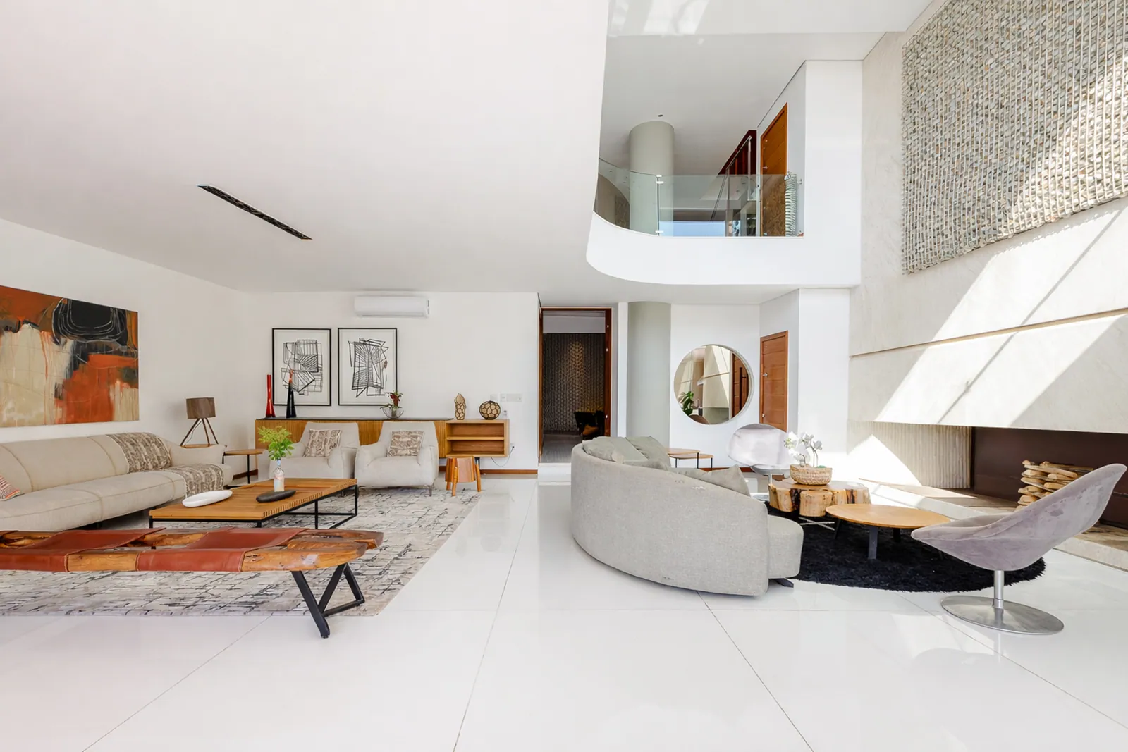 The double-height living room, white throughout