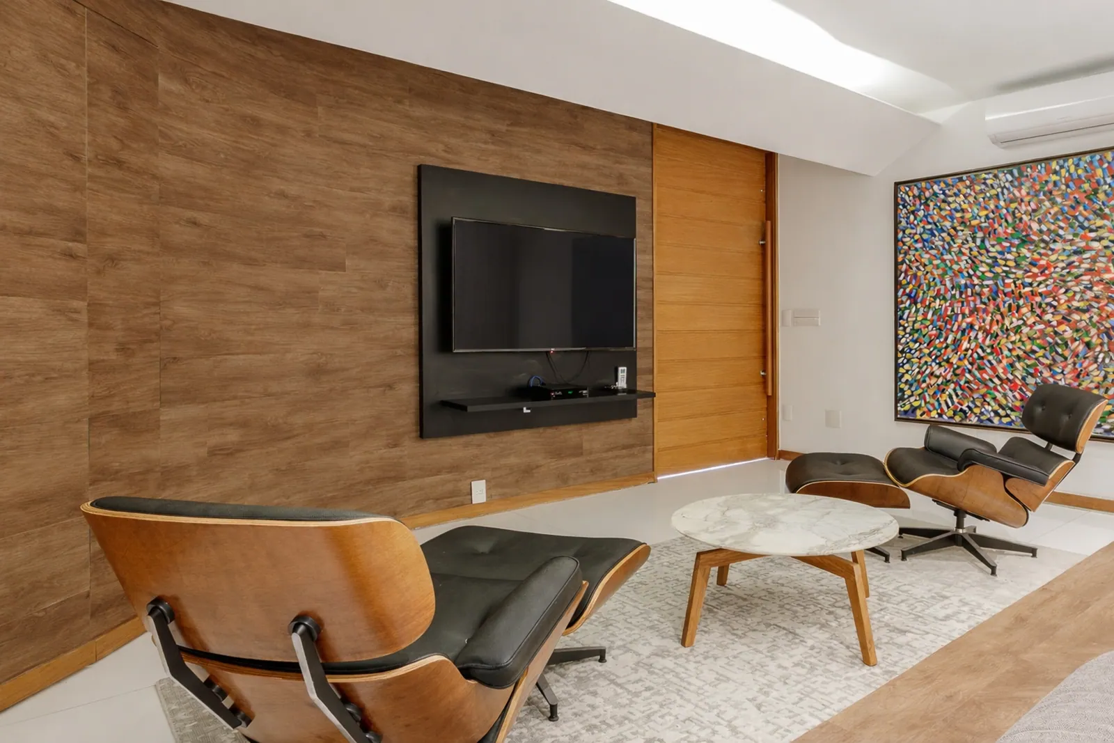 The screening room, lounge chairs facing the screen