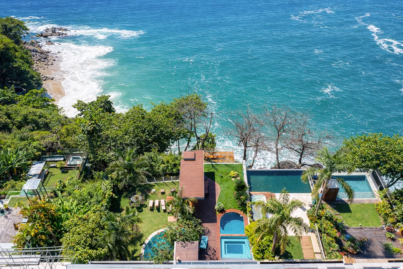 The garden dropping away to the rocks and the open sea