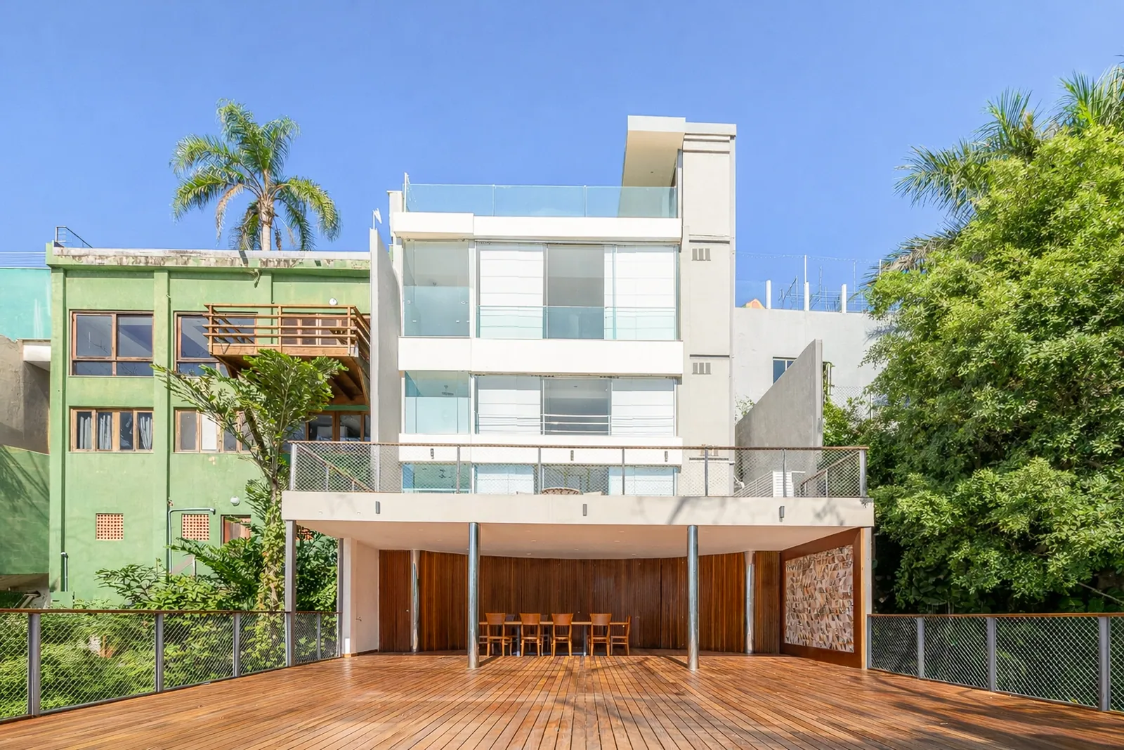 The house seen from the lower garden, deck and bar in front