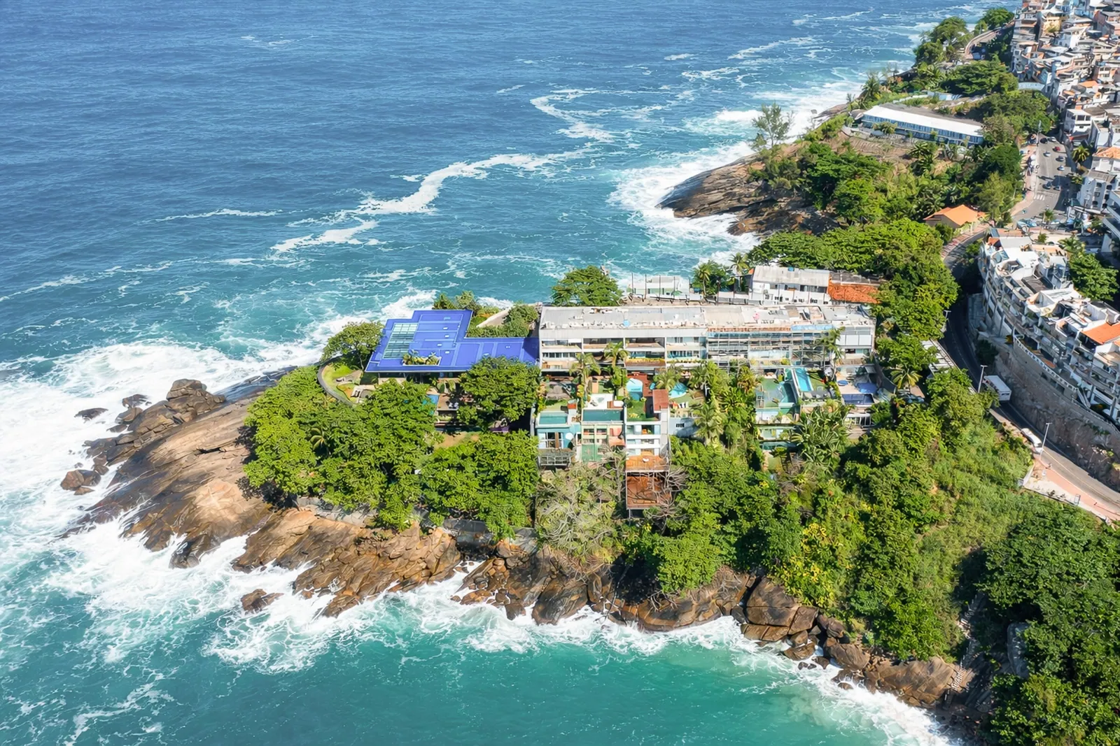 The house on its rocky headland, seen from the air