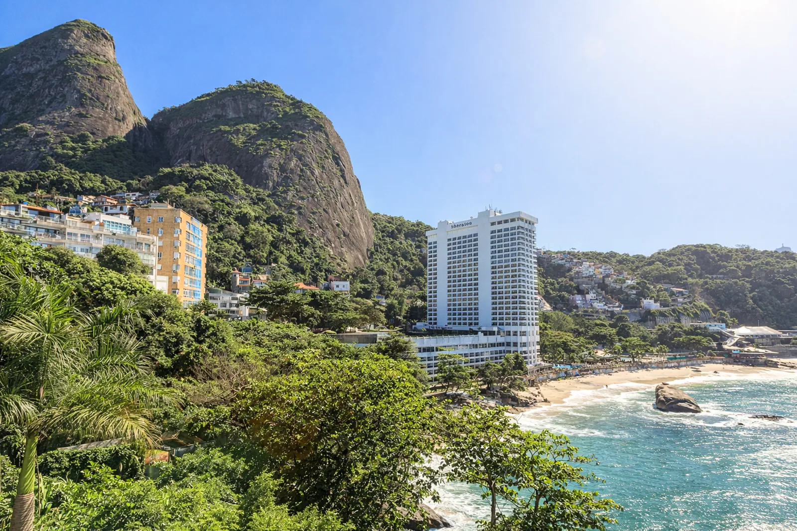 The Dois Irmãos above the cove, the coast road below