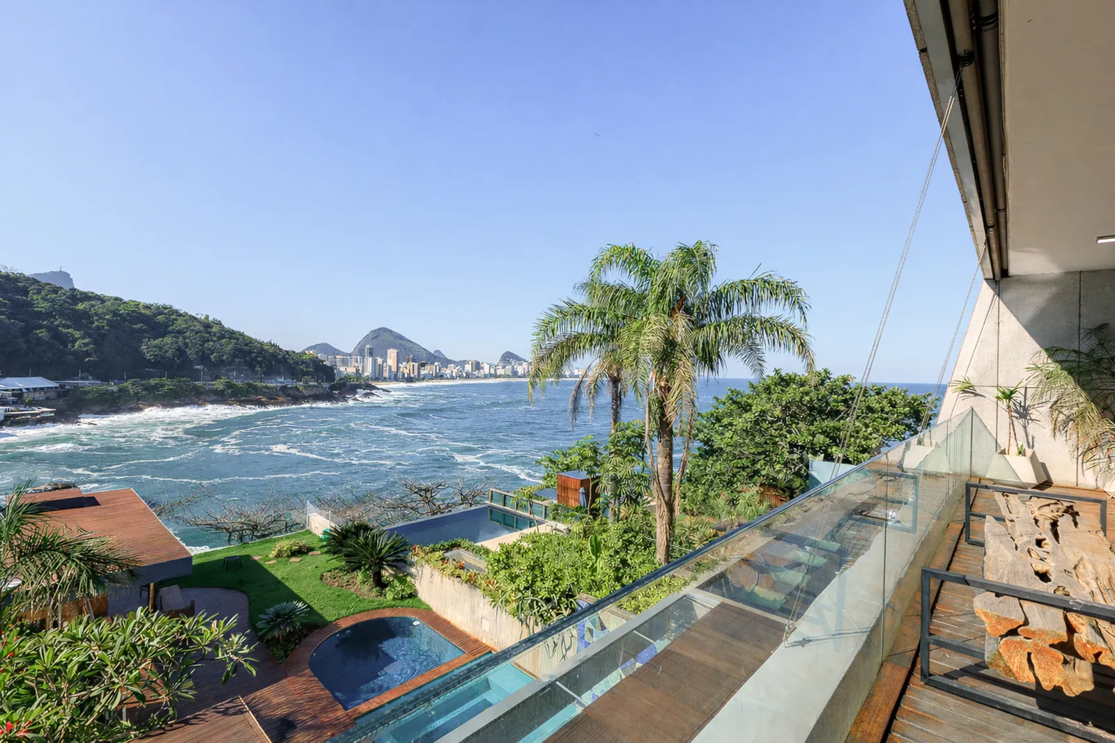 The deck and its glass balustrade, the bay opening below