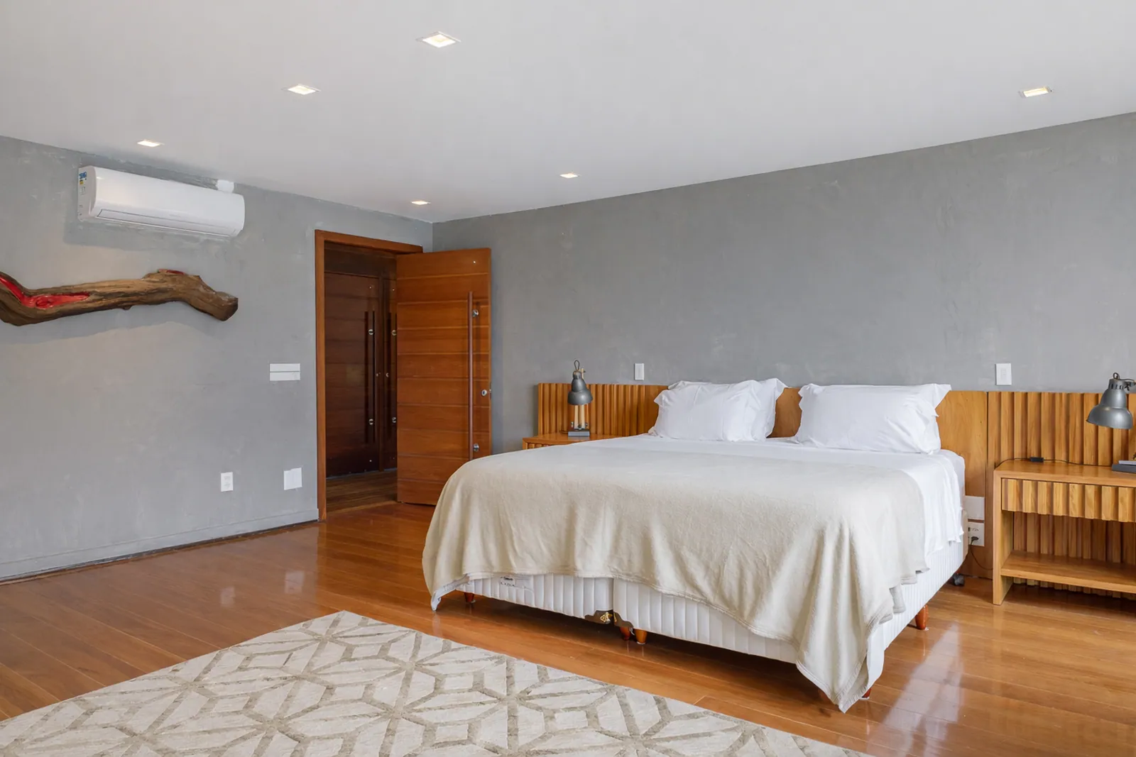 Bedroom in soft grey, wood floor throughout