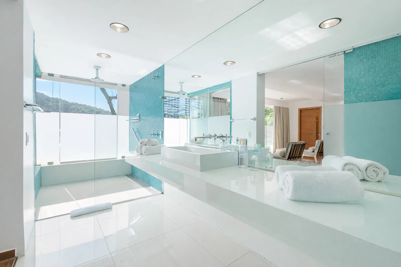 Bathroom with turquoise glass and double vanity